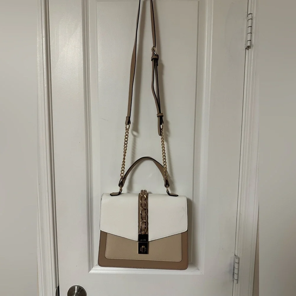 ALDO women's handbag with a top handle and chain detail.